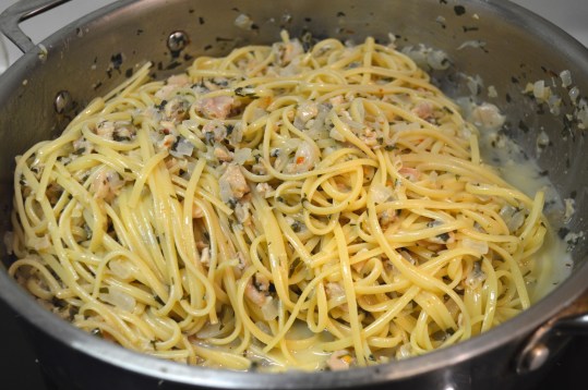 Finishing the Pasta in the Clam Sauce